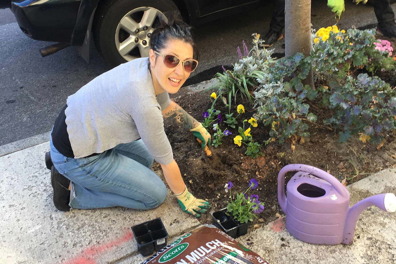 Image of a Baltimore School for the Arts student planting flowers