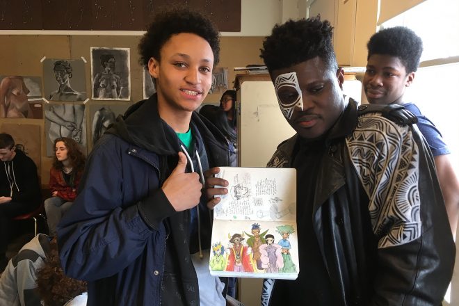 Photograph of Baltimore School for the Arts students showing off their work