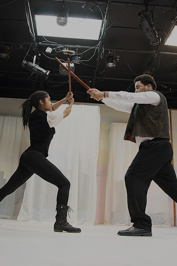 Photograph of Baltimore School for the Arts theatre students practicing swordplay