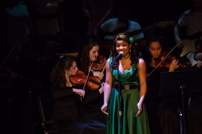 Image of Baltimore School for the Arts students singing on stage