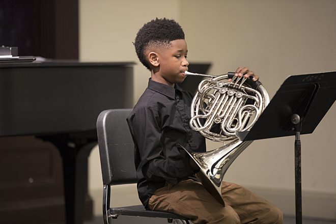 Image of a Baltimore School for the Arts student playing an instrument