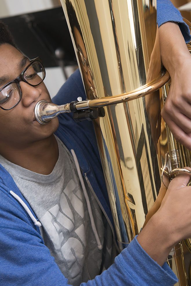 Portrait of student playing the tuba