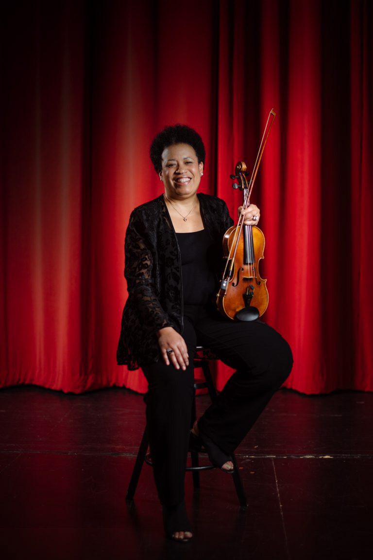 Image of women playing a violin at the Baltimore School for the Arts